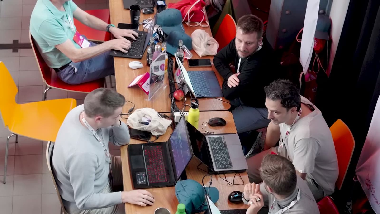 Top-down view of a team deep in work at a shared table