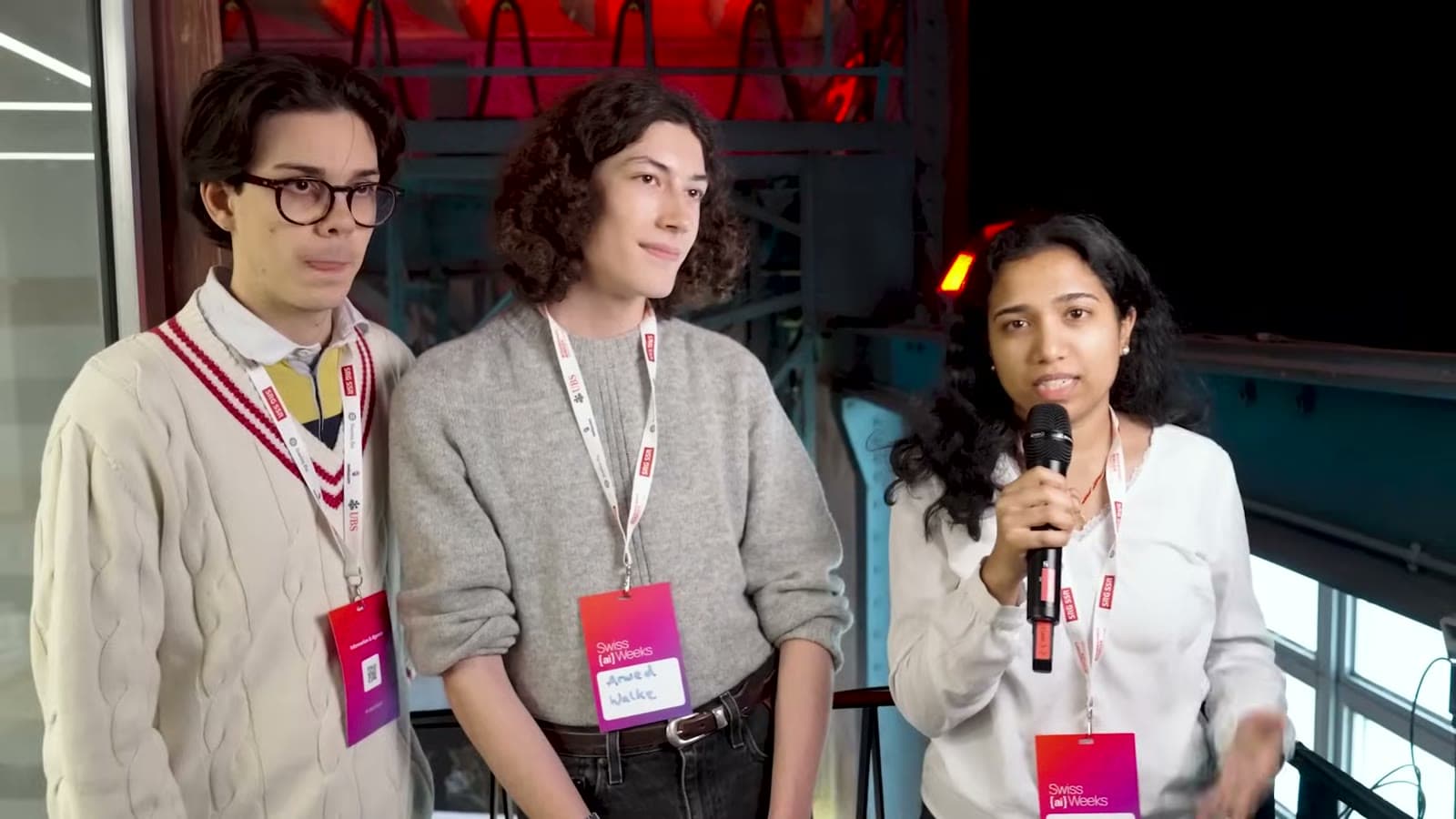 Hacker team answering interview questions at the venue